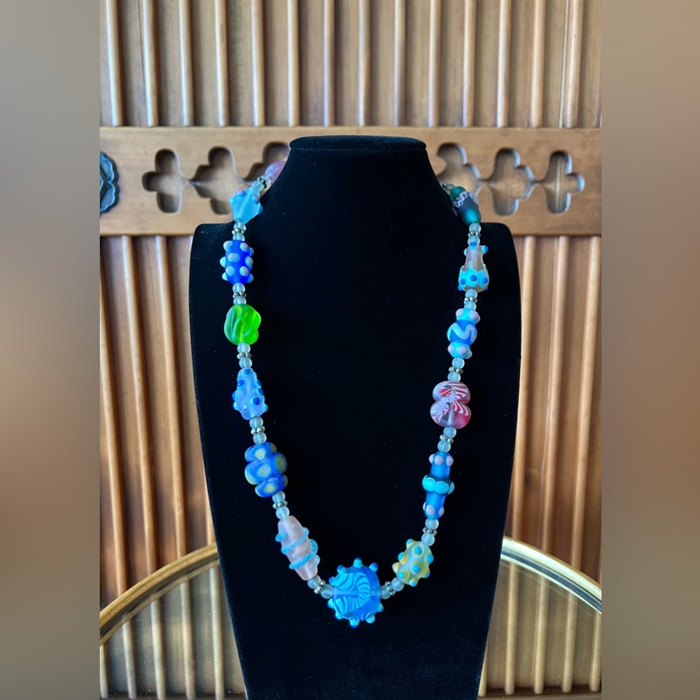 Each glass bead, a work of art! Perfect with any casual outfit - jeans to skirt.